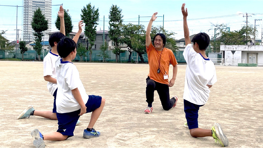 写真：区立中学校 陸上部活動支援員（監督）